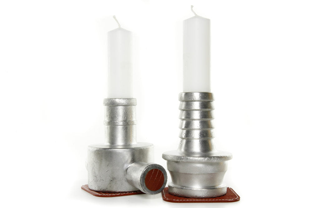 candlestick holders made from vintage fire-hose couplings