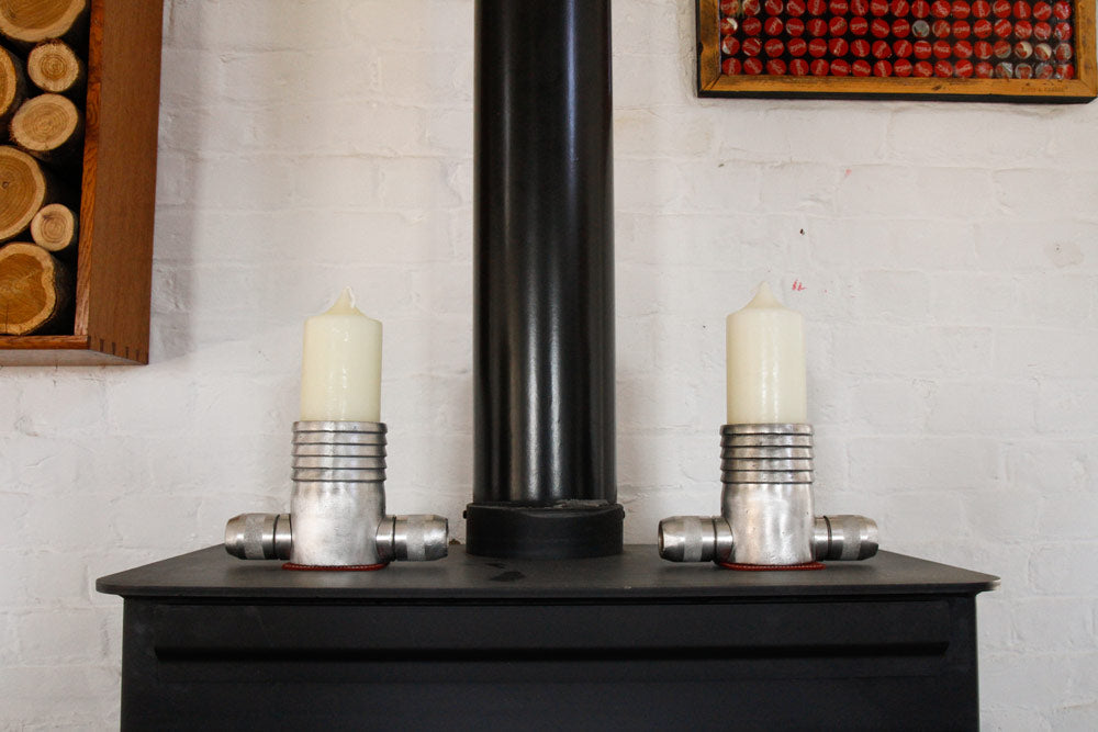 candlestick holders made from vintage fire-hose couplings