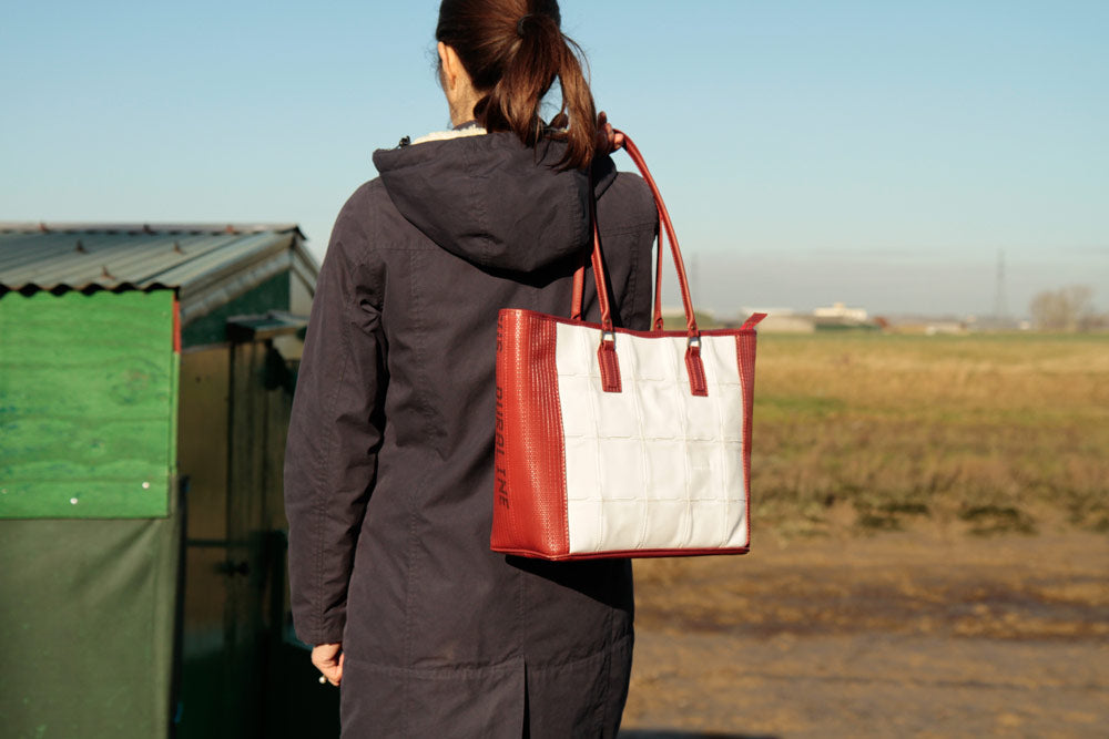 Recycled leather and decommissioned fire-hose tote bag