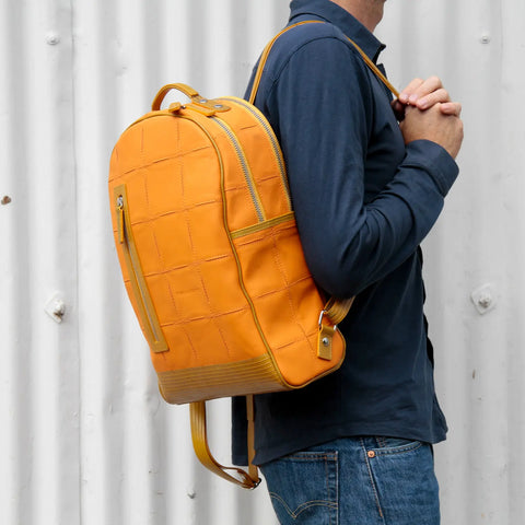 The Elvis & Kresse Voyager Backpack made from rescued leather and genuine decommissioned fire-hose