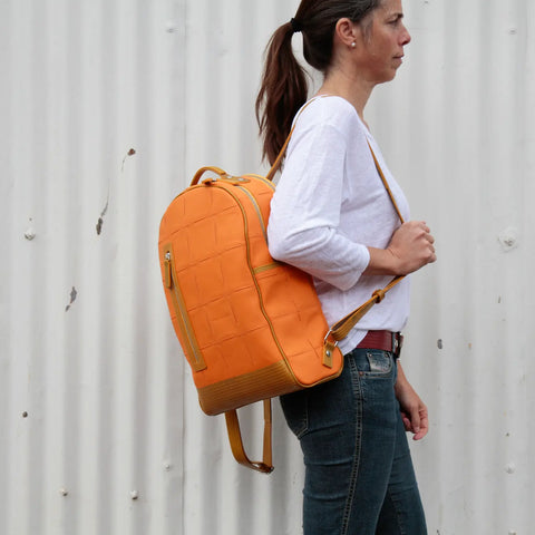 The Elvis & Kresse Voyager Backpack made from rescued leather and genuine decommissioned fire-hose