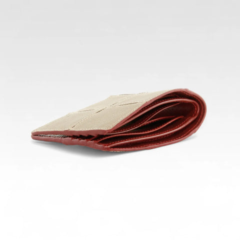 The Elvis & Kresse Billfold Wallet, available in khaki upcycled leather and red recycled fire-hose