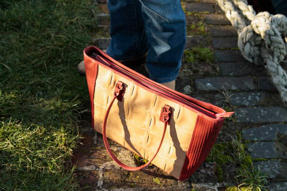 Recycled leather and decommissioned fire-hose tote bag