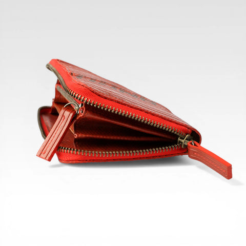 eco-friendly vegan leather purse made from rescued materials with a rescued parachute lining