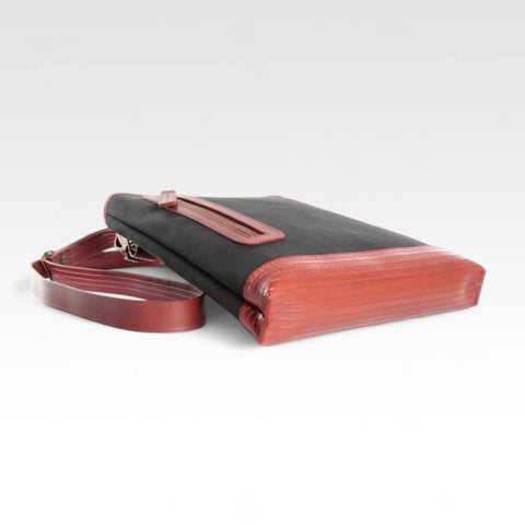 The Elvis & Kresse Reporter bag, a small crossbody messenger bag made from recycled materials