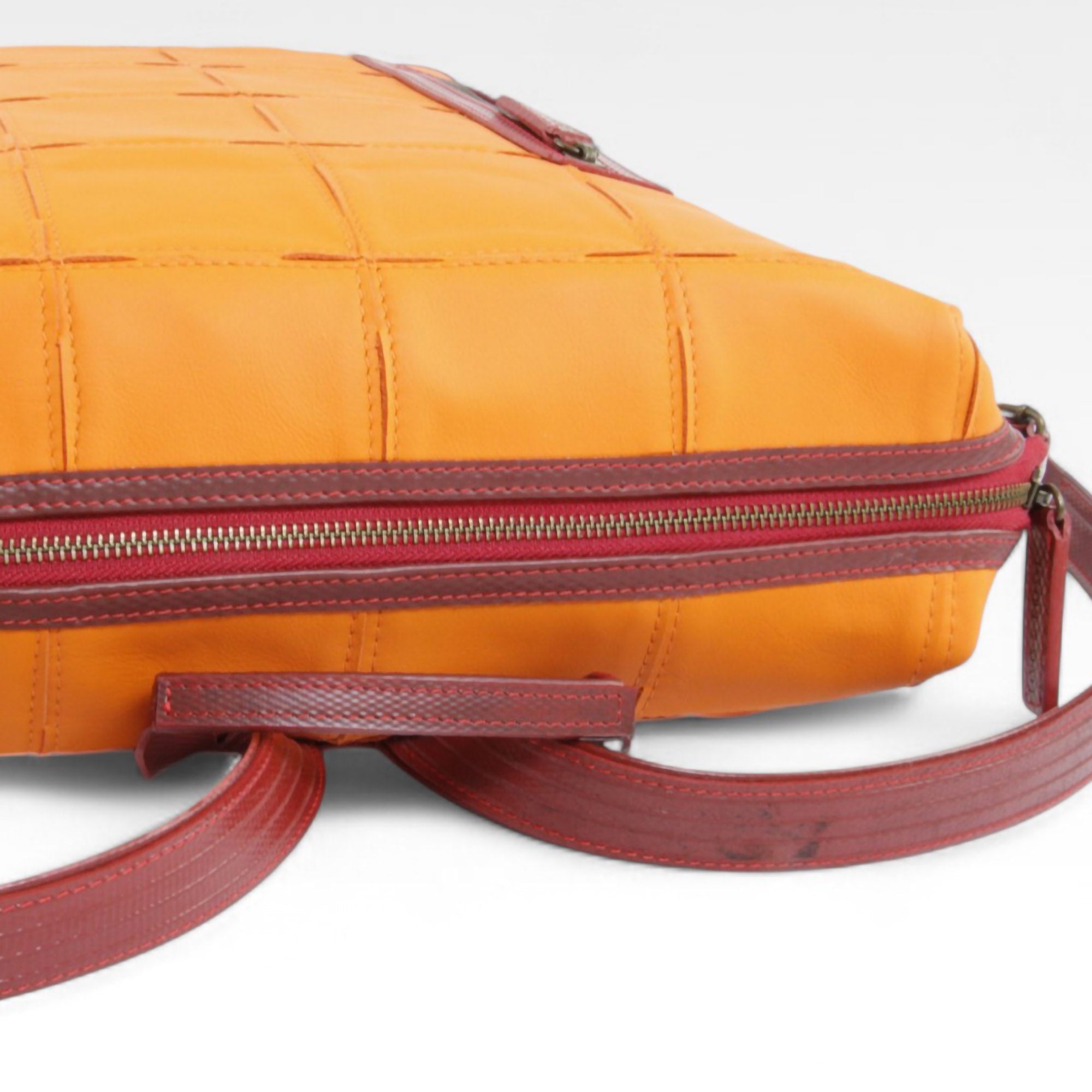 backpack-orange-2-detail_f2d85c7d-b8ed-41b8-a1b4-ca4865bed018.jpg