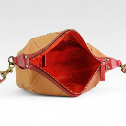 eco-friendly, sustainable leather crossbody bag made from low carbon materials with a rescued parachute lining