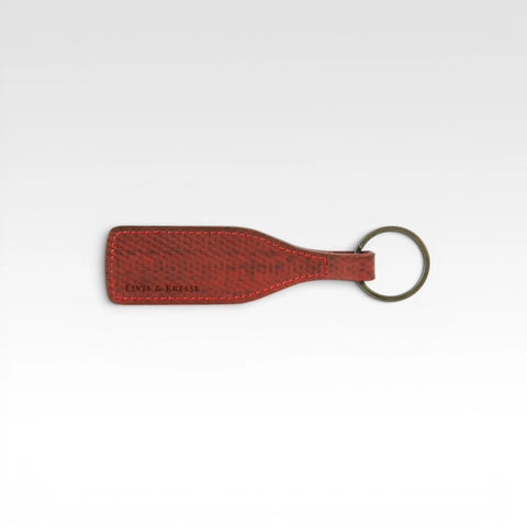 The Elvis & Kresse Wine bottle key ring, available in red recycled fire-hose