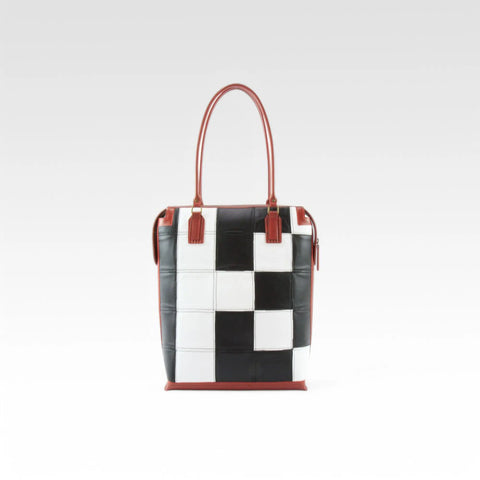 The Elvis & Kresse Dutch Tote, available in black and white upcycled leather and red recycled fire-hose