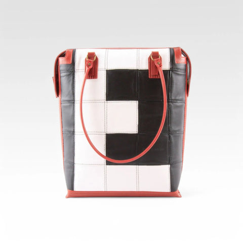 The Elvis & Kresse Dutch Tote, available in black and white upcycled leather and red recycled fire-hose