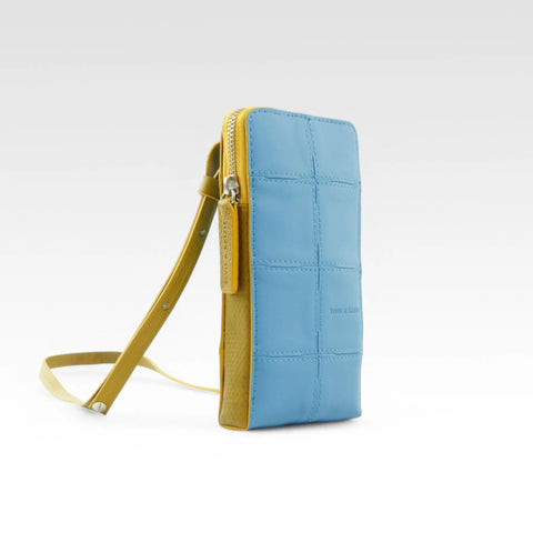 Elvis & Kresse Crossbody Pouch is an ethical and sustainable small crossbody bag: carry phone, wallet and other essentials