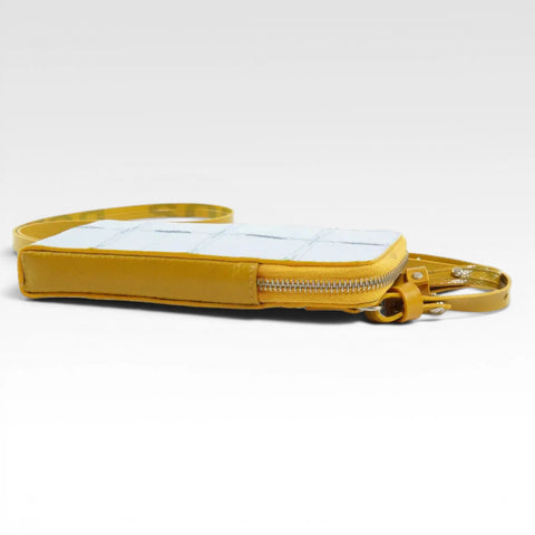 The Elvis & Kresse Crossbody Pouch, available in pale blue upcycled leather and yellow recycled fire-hose