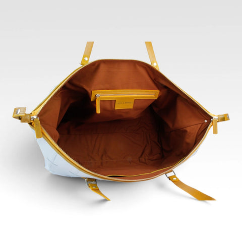 eco-friendly sustainable leather weekend bag made from low carbon materials with a rescued cotton lining