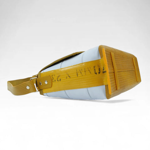 The Elvis & Kresse Field Bag, available in camel upcycled leather and red recycled fire-hose