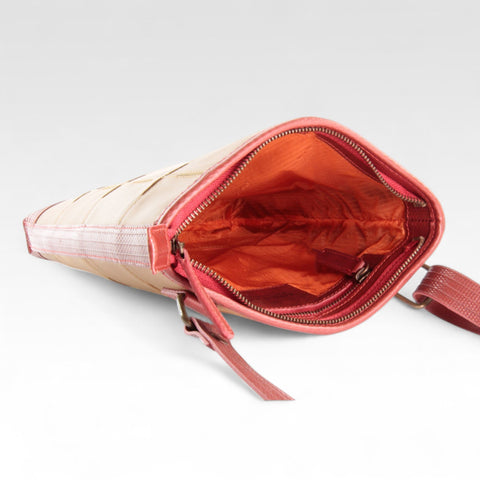 eco-friendly, sustainable leather crossbody bag made from low carbon materials with a rescued parachute lining
