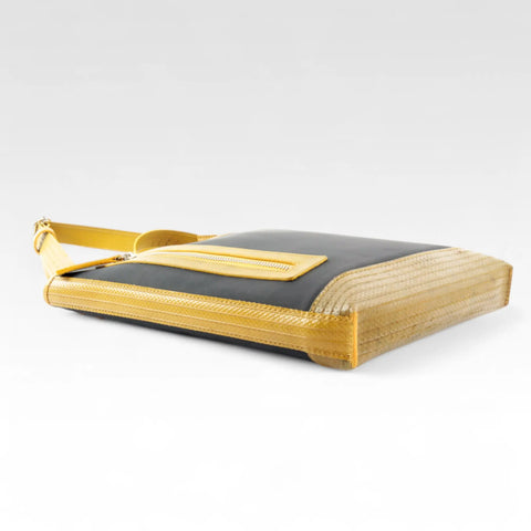 The Elvis & Kresse Reporter bag, a small crossbody messenger bag made from recycled materials