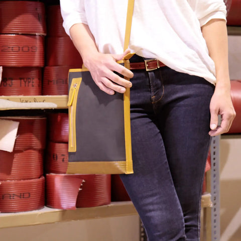 The Elvis & Kresse Reporter bag carried by a female model - 5ft 4inch