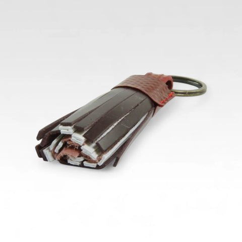 Sustainable tassel key chain, ethically made by Elvis & Kresse from recycled materials