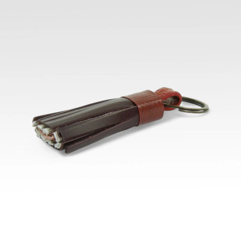 Sustainable tassel key chain, ethically made by Elvis & Kresse from recycled materials