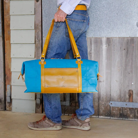 eco-friendly luxury leather duffel bag made from rescued materials