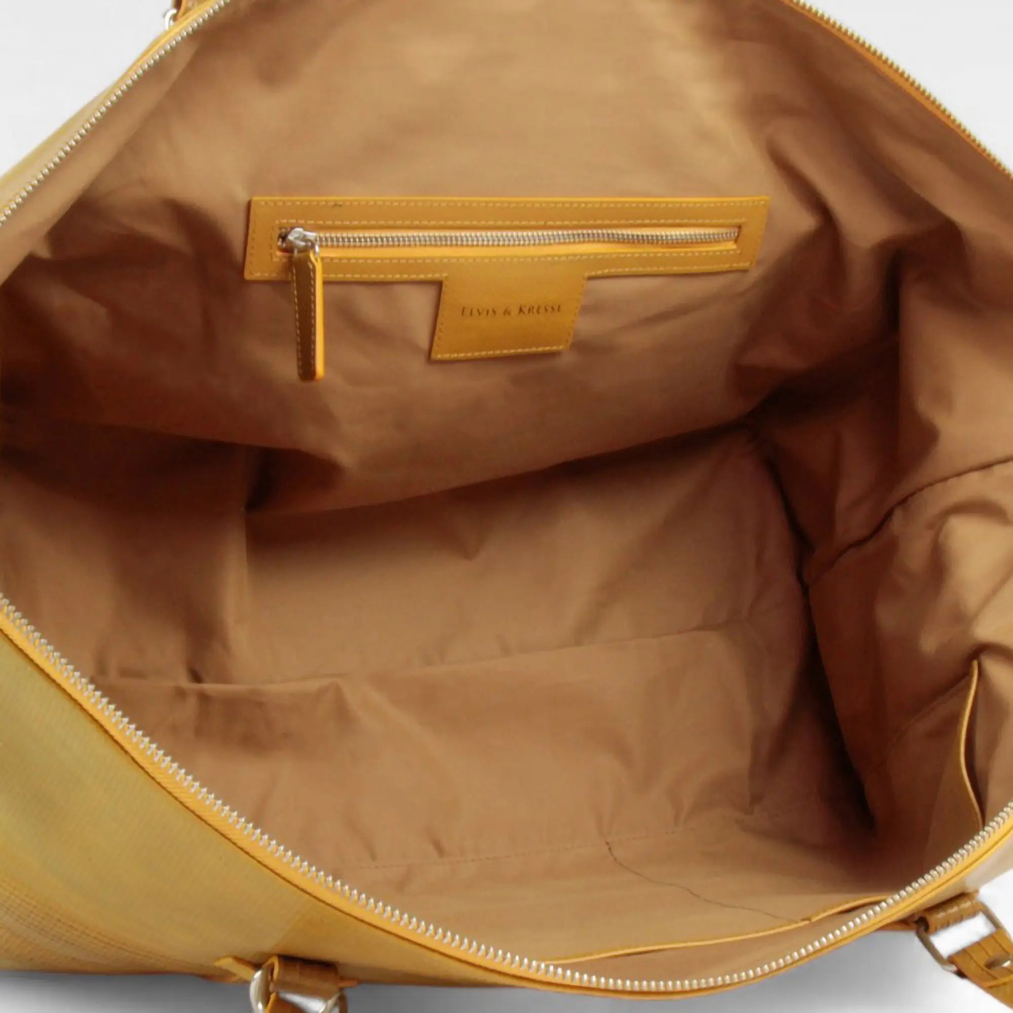 weekend-bag-yellow-tan-lining-detail.webp
