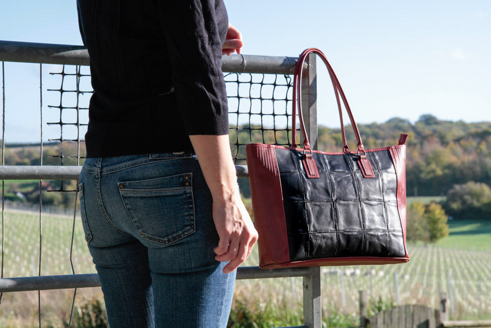 Recycled leather and decommissioned fire-hose tote bag