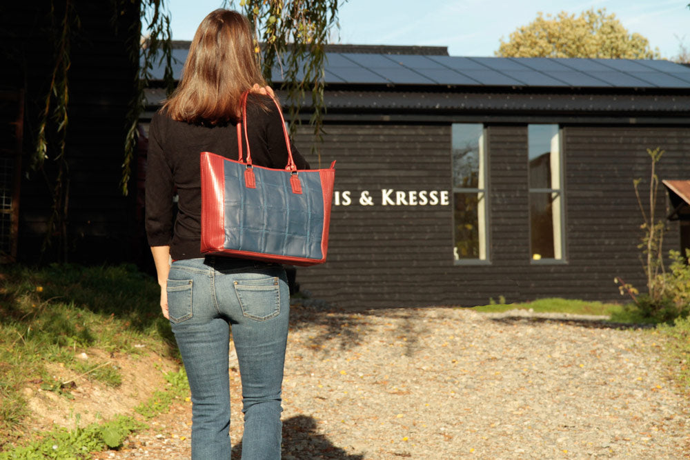 Recycled leather and decommissioned fire-hose tote bag